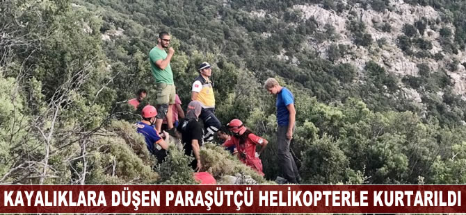 Kayalıklara düşen paraşütçü helikopterle kurtarıldı